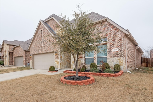 view of front facade with a garage and a front yard