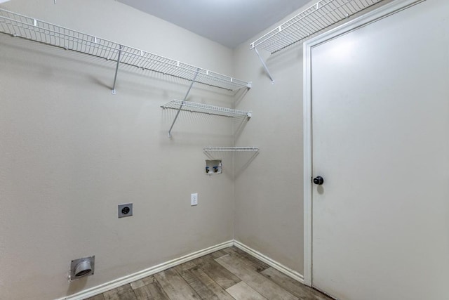 clothes washing area with washer hookup, hardwood / wood-style floors, and hookup for an electric dryer