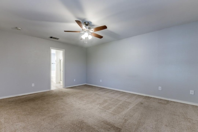 carpeted empty room featuring ceiling fan