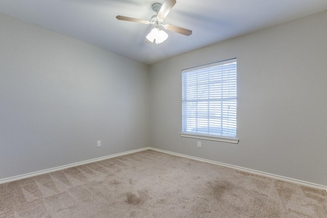 unfurnished room with light carpet and ceiling fan