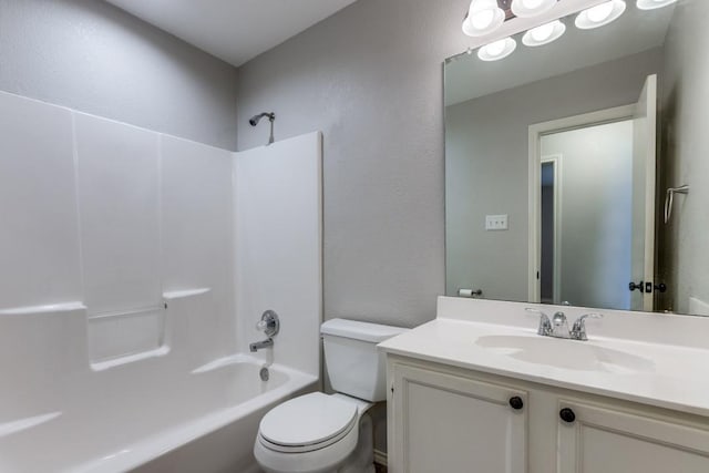 full bathroom with vanity, shower / tub combination, and toilet