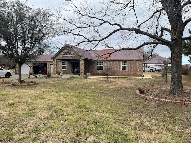 view of front of home featuring a garage and a front lawn