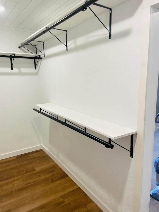 walk in closet featuring hardwood / wood-style flooring