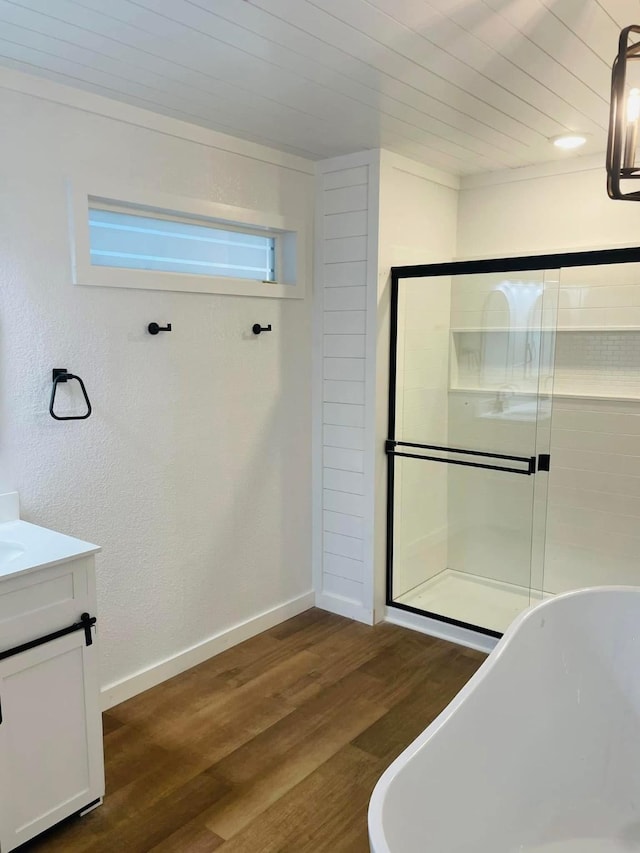 bathroom featuring independent shower and bath, wood-type flooring, wooden ceiling, and vanity