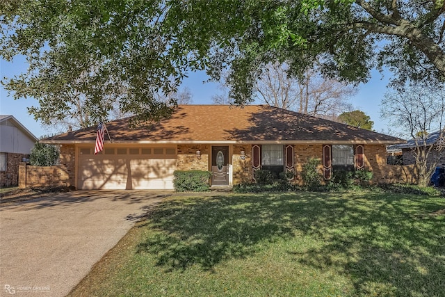 ranch-style home featuring a garage and a front yard