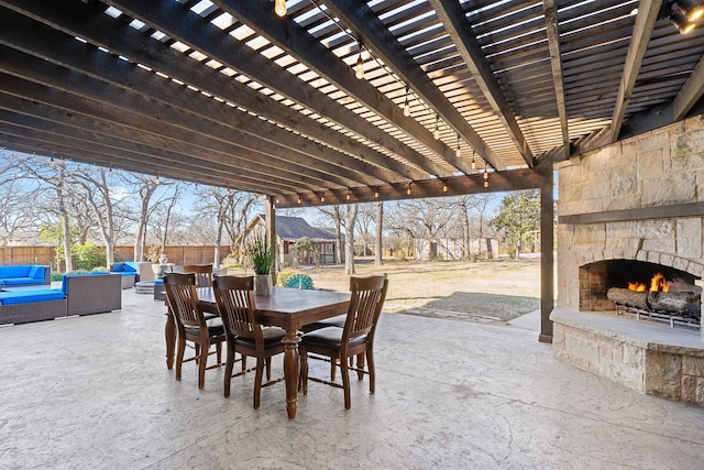 view of patio / terrace with an outdoor living space with a fireplace and a pergola