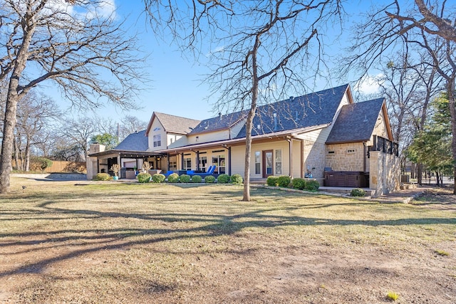 rear view of house featuring a yard