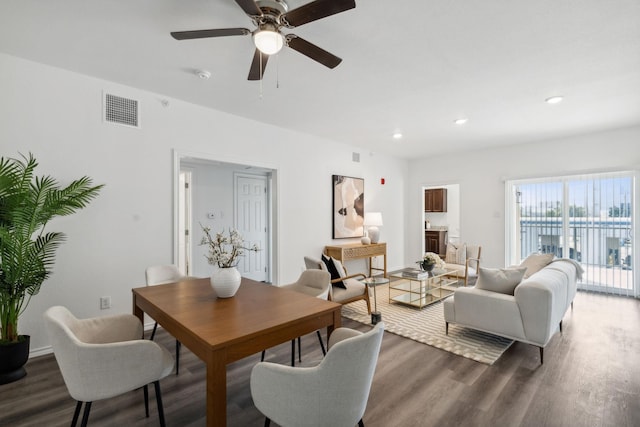 living room with ceiling fan, visible vents, wood finished floors, and recessed lighting