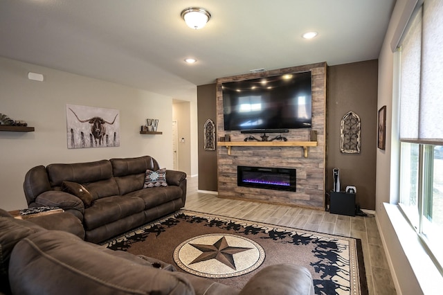 living room with a stone fireplace