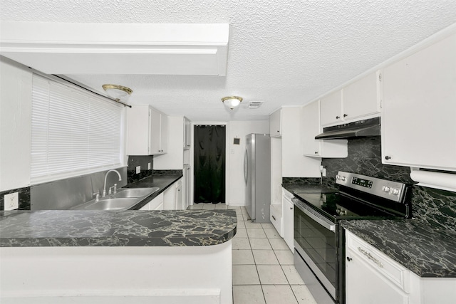 kitchen with sink, light tile patterned flooring, white cabinets, and appliances with stainless steel finishes