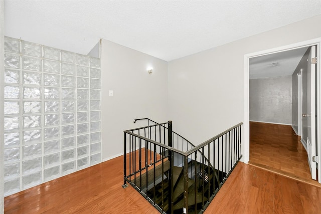 stairs featuring wood-type flooring