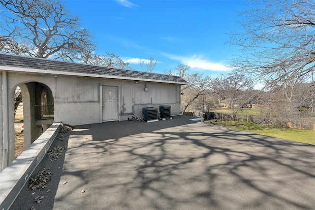 exterior space featuring cooling unit and a patio area