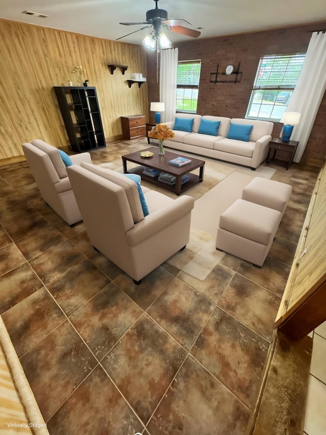 321 Bowles Ct, Kennedale, TX 76060 - tiled living area featuring wooden walls, visible vents, and a ceiling fan