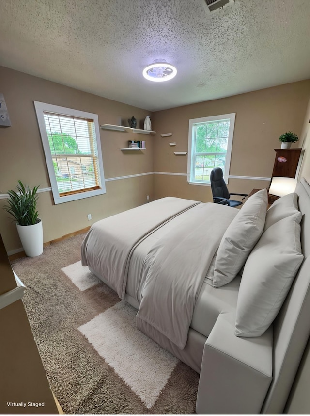 321 Bowles Ct, Kennedale, TX 76060 - bedroom with a textured ceiling and visible vents