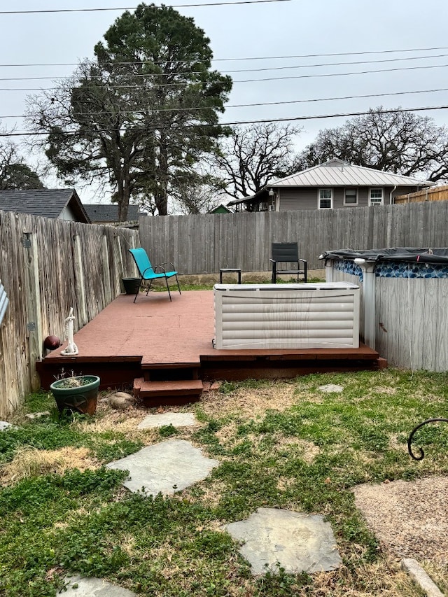 view of yard with a swimming pool side deck