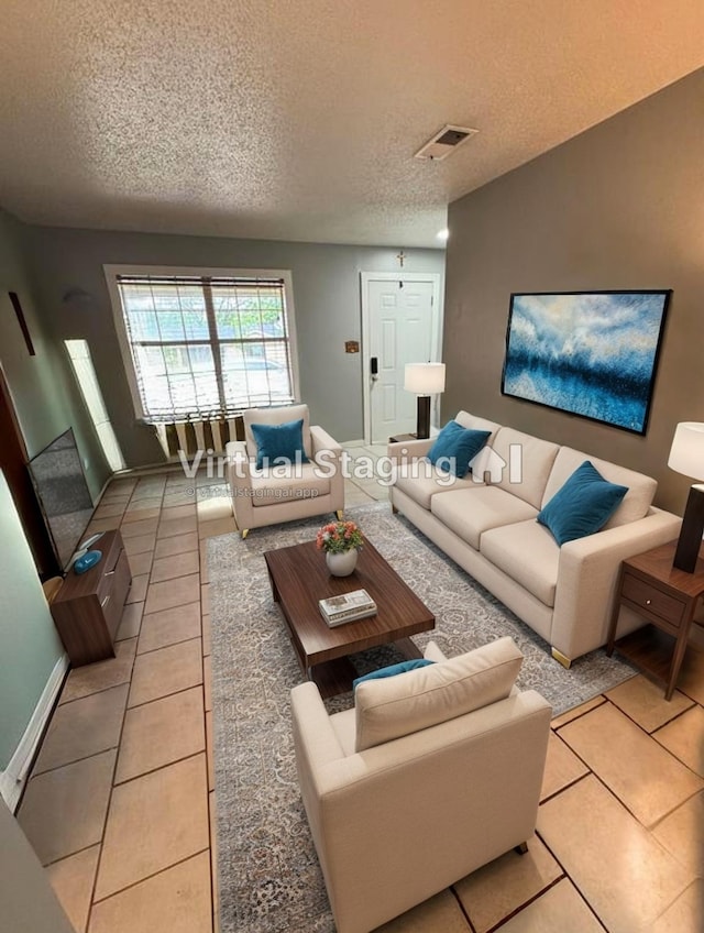 321 Bowles Ct, Kennedale, TX 76060 - living area featuring visible vents, a textured ceiling, baseboards, and light tile patterned floors
