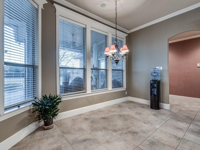 unfurnished dining area featuring a notable chandelier, crown molding, a wealth of natural light, and light tile patterned flooring