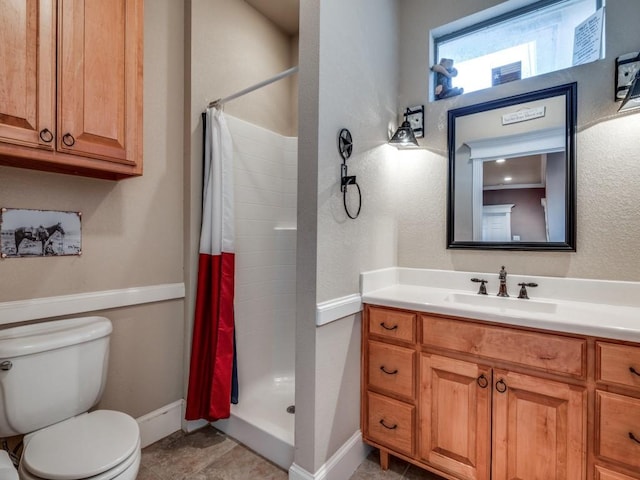 bathroom with vanity, tile patterned flooring, toilet, and walk in shower