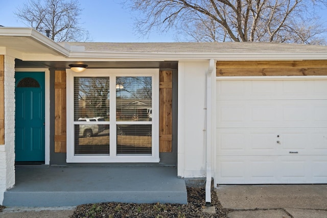 doorway to property featuring a garage