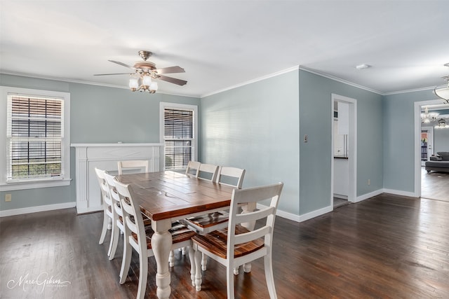 dining space featuring dark hardwood / wood-style flooring, crown molding, and ceiling fan with notable chandelier