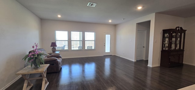 living room featuring dark wood-type flooring