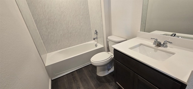 full bathroom featuring vanity, bathtub / shower combination, hardwood / wood-style floors, and toilet