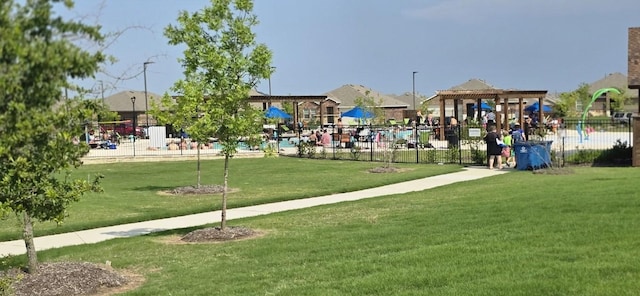 surrounding community featuring a yard and a playground