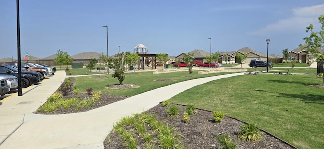 view of home's community featuring a lawn