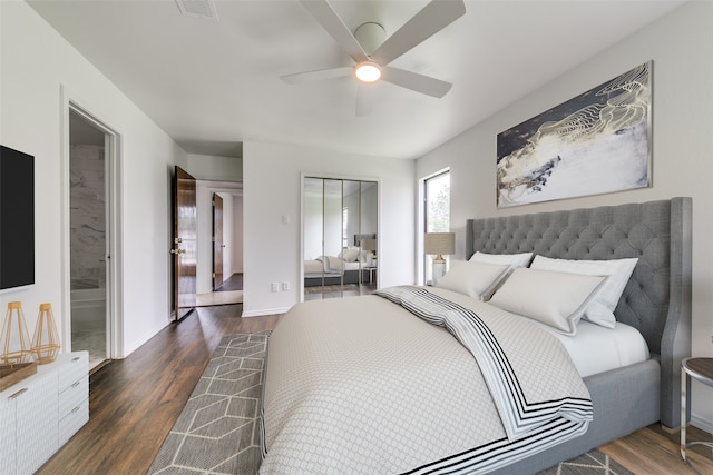 bedroom with dark hardwood / wood-style flooring, a closet, ceiling fan, and ensuite bathroom