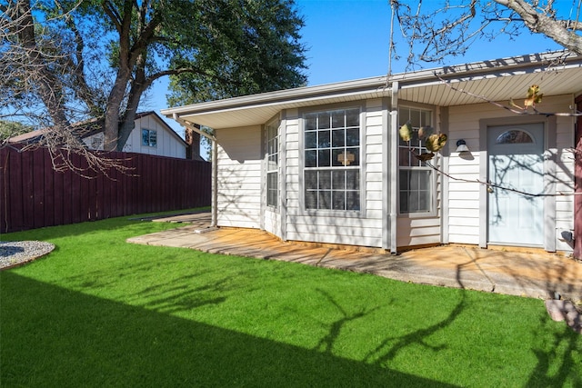 exterior space featuring a yard and a patio area