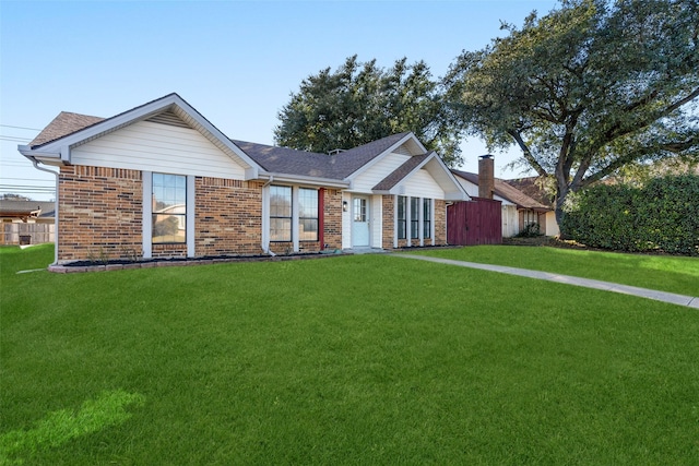 single story home featuring a front yard