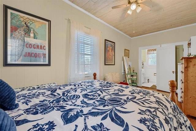 bedroom featuring ceiling fan, crown molding, ensuite bathroom, and wood ceiling