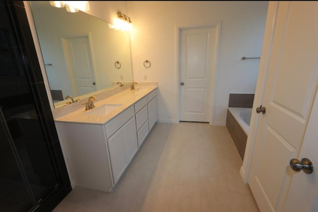 bathroom with vanity and separate shower and tub