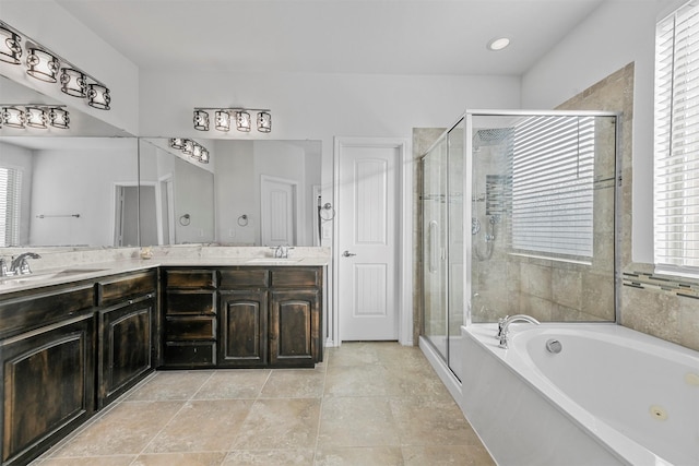 bathroom featuring vanity and separate shower and tub