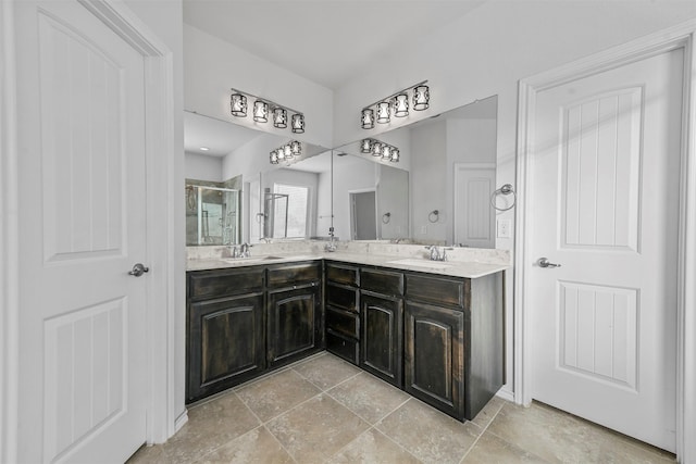 bathroom with a shower with door and vanity