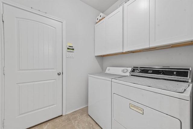 laundry area with cabinets and washing machine and dryer