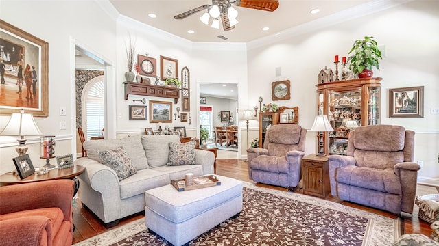 living room with ornamental molding, hardwood / wood-style floors, and plenty of natural light