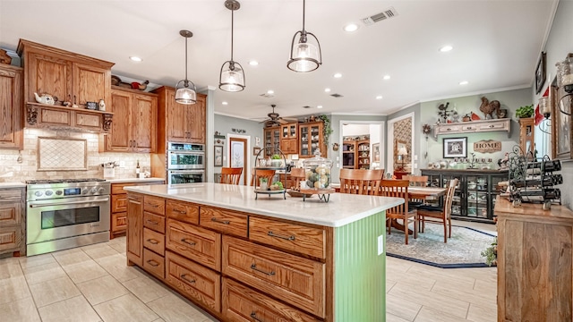 kitchen with pendant lighting, stainless steel appliances, a center island, ornamental molding, and decorative backsplash