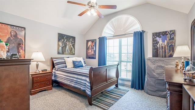 bedroom featuring multiple windows, vaulted ceiling, and ceiling fan