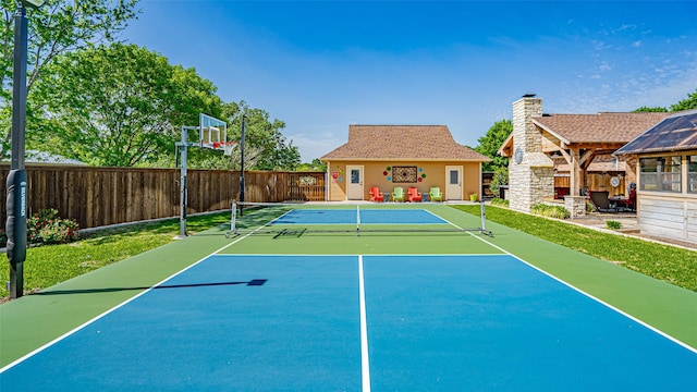 view of sport court featuring basketball hoop