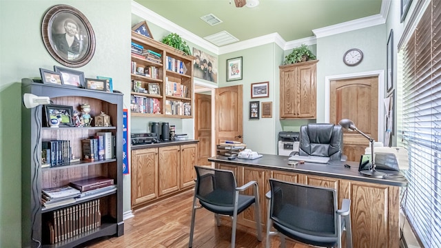 office space with crown molding and light hardwood / wood-style flooring