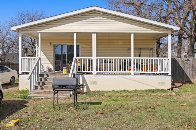 view of front of house with a front lawn and a porch