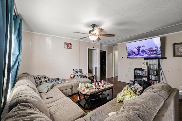 living room featuring ornamental molding, dark hardwood / wood-style floors, and ceiling fan