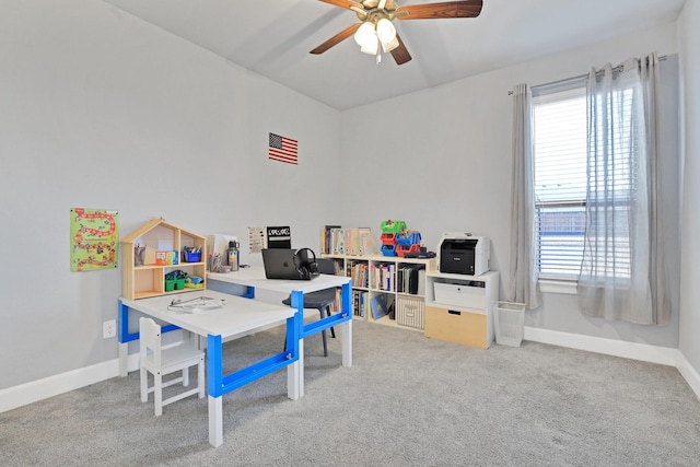 rec room with carpet floors and ceiling fan