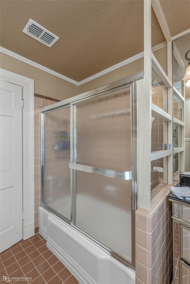 bathroom with bath / shower combo with glass door, crown molding, tile patterned floors, and a textured ceiling