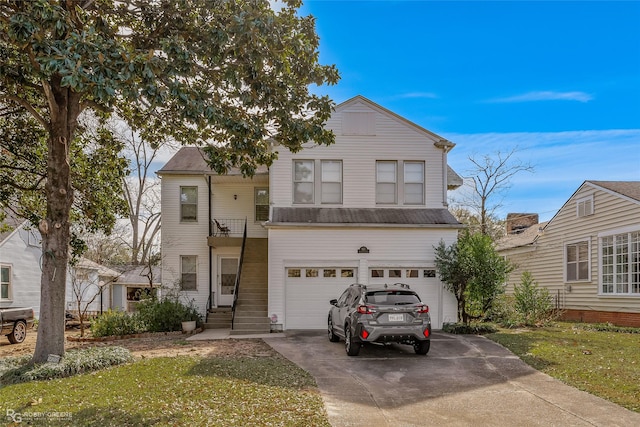 view of property featuring a garage and a front yard