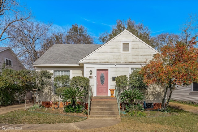 bungalow with a front yard