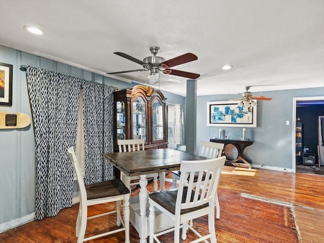 dining space with hardwood / wood-style flooring and ceiling fan