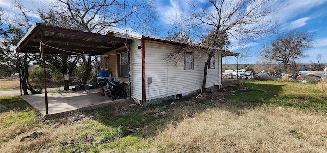 view of side of home featuring a carport