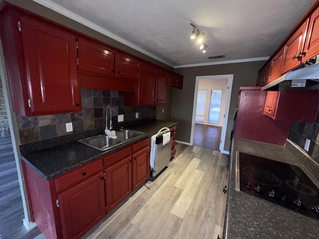 kitchen featuring sink, ornamental molding, dishwasher, light hardwood / wood-style floors, and black stovetop